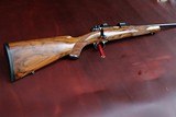 DAKOTA 22 WITH OPTIONS "FRENCH WALNUT, WRAP CHECKERING, INLETTED SWIVEL STUDS "LEUPOLD BASES, 5 PANEL CHECKER BOLT, JEWEL TRIGGER" - 11 of 15