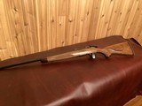 REMINGTON CUSTOM SHOP MODEL 547 C GRADE .22 LR WITH UPGRADED HAND RUBBED OIL FINISH AND HAND CHECKERING - 11 of 12