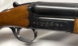 SKB/ Ithaca model 100, 12 gauge double barrel shotgun, 25" BBLS. Choked Imp Cyl/Mod, Excellent Cond.