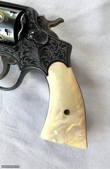 Smith & Wesson (S&W) Military & Police (Pre-Model 10)
38 S&W,
Mother-of-Pearl - 9 of 14