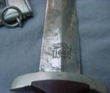 German WWII SA NSKK Dagger with scabbard, blade marked “TIGER SOLINGEN.”
- 10 of 13