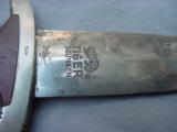 German WWII SA NSKK Dagger with scabbard, blade marked “TIGER SOLINGEN.”
- 9 of 13