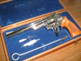 Smith & Wesson Model 29-2
8 3/8" Nickel Plated Revolver with Presentation Case and Accessories - 2 of 4