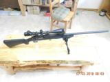 Remington 700 sps Varmit 22-250 and
8X32 scope & Bi-pod - 1 of 13