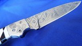 CUSTOM ED SCHEMPP HORNETS NEST MOSAIC DAMASCUS FIXED BLADE KNIFE /SANTA FE STONEWORKS PEARL & JET INLAYED
ART DECO HANDLE with STAND - 7 of 11