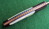 VALLOTTON
CUSTOM
AUTO KNIFE~ DAMASCUS / MOTHER OF PEARL "ANGEL WING" NEW IN POUCH! **DEALER** - 7 of 12