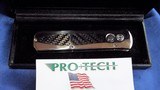 PRO-TECH Custom
Edition "GODSON"
AUTO Knife Solid Mirror Polished TITANIUM
with Carbon Fiber Inlays NOS - 10 of 15