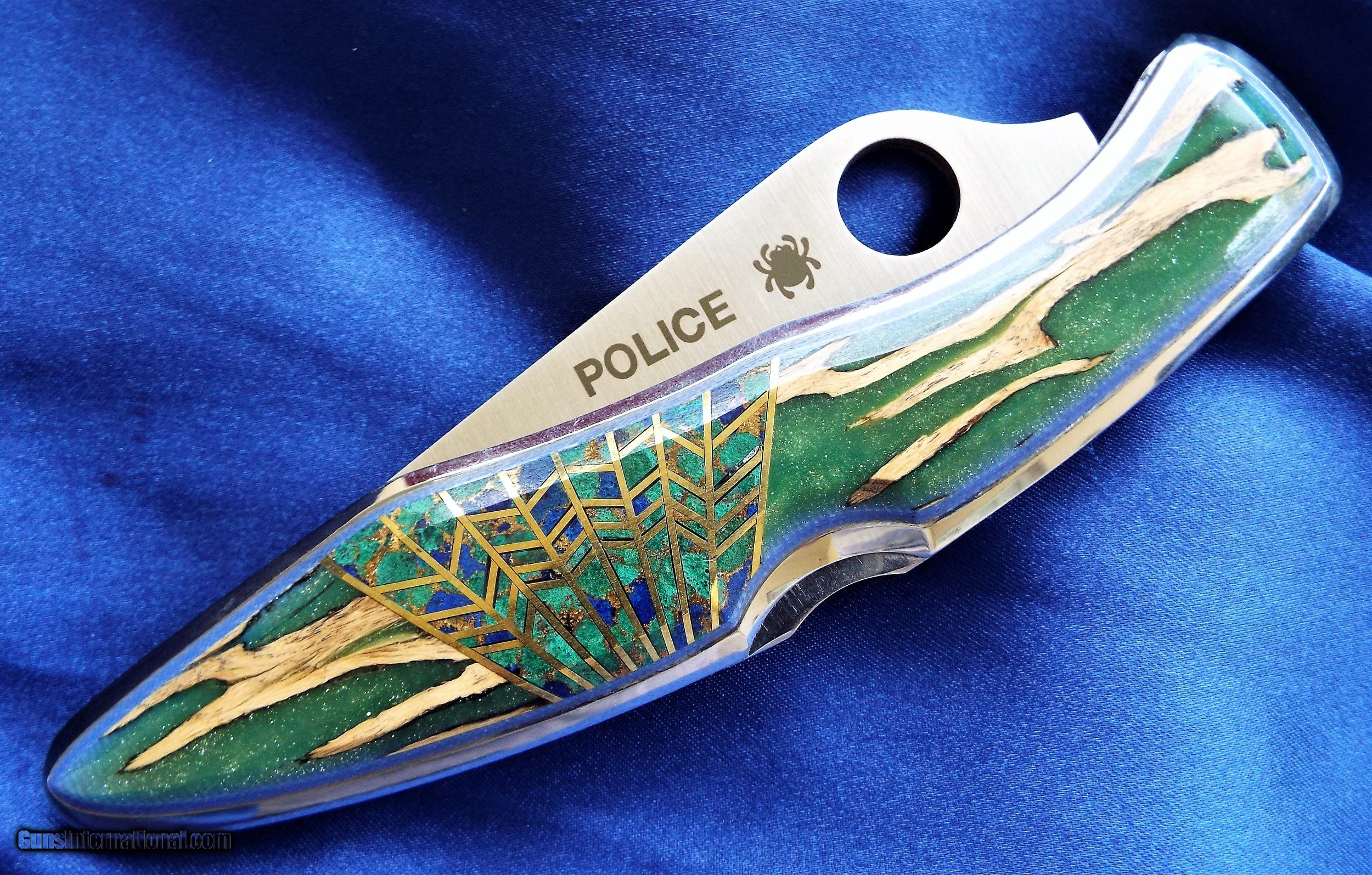 https://images.gunsinternational.com/listings_sub/acc_83408/gi_101436268/CUSTOM-Santa-Fe-Stoneworks-Spyderco-inch-POLICE-MODELinch-CHOLLA-CACTUS-in-GLOW-IN-THE-DARK-EPOXY-AZ_101436268_83408_58D924290D398031.JPG