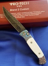PRO-TECH
BREND 2 CUSTOM
Titanium Custom "Flomascus" frame ~ Ivory Micarta Inlays ~ Nichols Mosaic Damascus Blade. Authorized Dealer - 1 of 6
