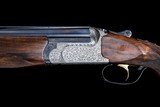 Custom Perazzi SC3 grade (MX8) w/ selective trigger, 34 in. comp bored barrels, exhibition wood, master engraved and signed, flat filed tapered rib. - 2 of 12