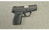 Taurus ~ 709 Slim ~ 9mm - 1 of 2