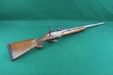 Cooper Firearms of Montana 57M LVT .22 LR Bolt Action Rifle with Stainless Varmint Barrel and Checked Walnut Stock