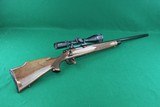 Remington Arms Co. Inc. 700 BDL Varmint Heavy Barrel .22 250 Rem Bolt Action Rifle with Checkered Walnut Stock & Vortex Scope