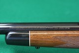 Remington Arms Co. Inc. 700 BDL Varmint Heavy Barrel .22-250 Rem Bolt Action Rifle with Checkered Walnut Stock & Vortex Scope - 16 of 25