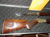 Marlin 90th Annoversary 2 Rifle - 39A Golden
39A #11 also Mountie 39 Nickle #26 - hand carved stock squirrel edt. - 8 of 11
