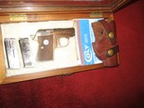 Colt 'Junior Colt Pocket' 25ACP Nickel-walnut display case, Sauer 'Snap Off' leather holster - 2 of 7