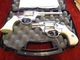 Hi-Standard
pair Sentinel Deluxe Nickel 9 SHOT 22 lr. cal.,
double action revolvers - 1 of 6