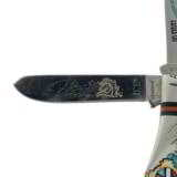 Double-bladed jackknife, handmade by Navajo artist David Yellowhorse.
- 7 of 7