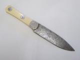 Custom engineered handmade Damascus steel knife signed T.R. Radant - 2 of 3