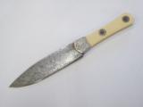 Custom engineered handmade Damascus steel knife signed T.R. Radant - 1 of 3