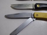 Lot of 4 folding blade knives.
Case P10051L, Case Sodbuster 2138, Case 183, and Case Sodbuster 2137 - 4 of 5