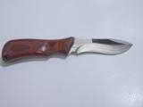 Buck Knives 497 hunting knife with rosewood handle. - 1 of 5