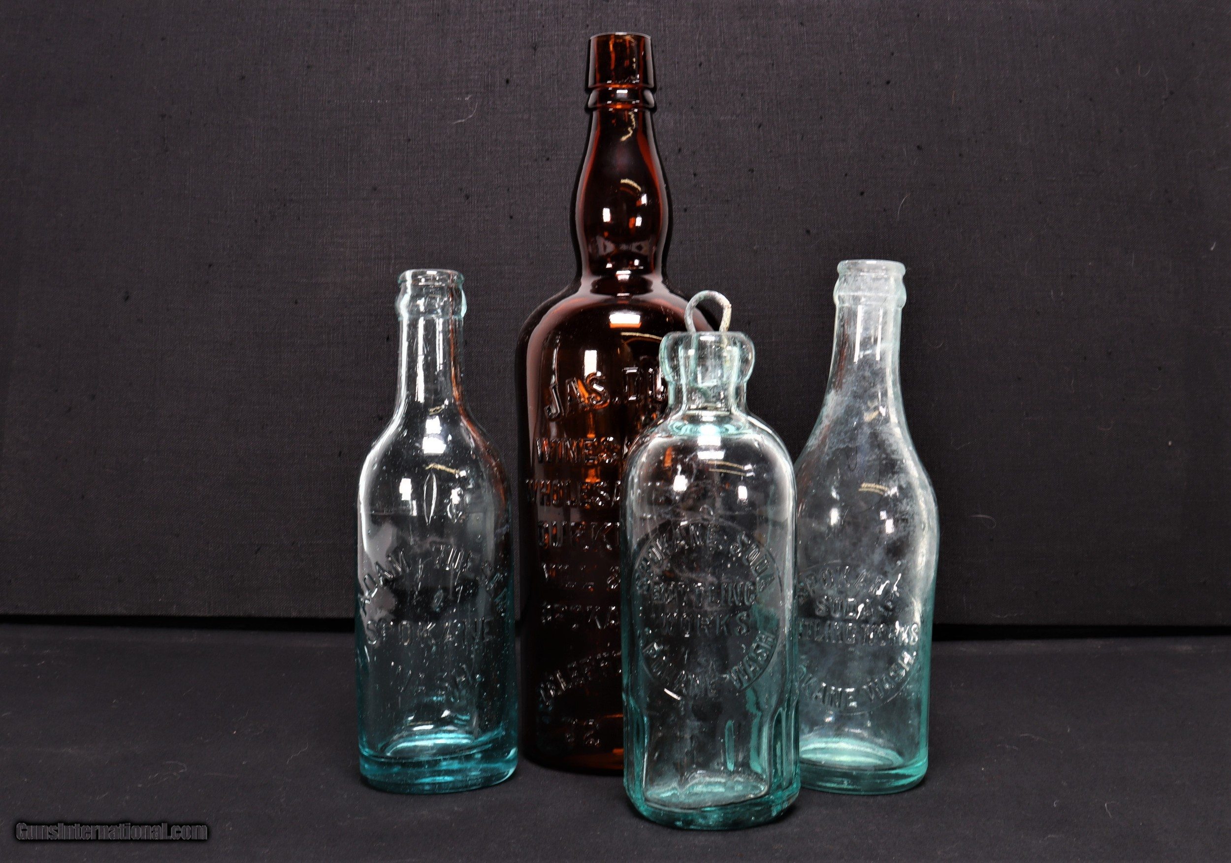 Four Spokane Vintage Bottles