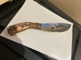 Colorful deer scene on blade and Solid Bone handle of knife 12" long 7 1/2" blade. In like new condition 99%. Great addition for anyone coll - 3 of 4