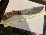 Colorful deer scene on blade and Solid Bone handle of knife 12" long 7 1/2" blade. In like new condition 99%. Great addition for anyone coll - 4 of 4