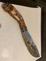 Colorful deer scene on blade and Solid Bone handle of knife 12" long 7 1/2" blade. In like new condition 99%. Great addition for anyone coll - 1 of 4