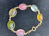 Six different precious stones set in solid 14kt. Gold - 1 of 2