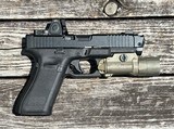 Used Glock 45 9mm W/ Trijicon RMR & Radian Afterburner Ramjet - 1 of 4