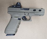 Used Glock 22 Gen 4
FDE .40 Night Sights MOS Optic Ready Ameriglo Trijicon RMR Red Dot Window Cuts - 1 of 3