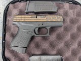 GLOCK 43 9MM ELITE BRONZE FLAG UI4350204 - Image 1 of 2