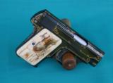 Custom 1908 Colt .25 auto with gold line inlay and color case trim.
- 1 of 7