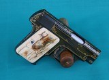 Custom Colt 1908 vest pocket .25 auto with gold inlay and mastodon grips - 1 of 7
