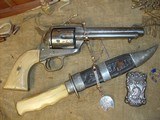 Nimschke engraved Colt SAA .45 with checkered ivory grips manufactured in1876 - 1 of 12