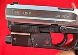 Heckler & Koch USP
.40 S&W
stainless like new with extras - 8 of 14