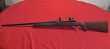 Ruger M77 7mm mag rifle with scope rings - Image 1 of 13