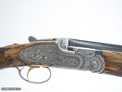 CSMC - A10, O/U Sidelock, Platinum Celtic Pattern, 12ga. 28” Barrels with Screw-in Choke Tubes. MAKE OFFER.