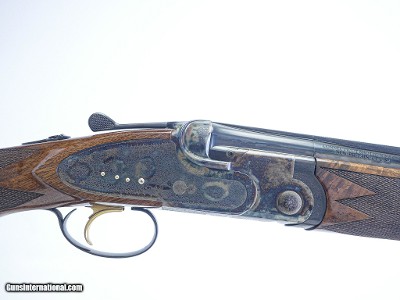 CSMC - A10, O/U Sidelock, Rose & Scroll, 12ga. 28” Barrels with Screw-in Choke Tubes. MAKE OFFER.