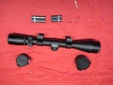 Weaver 3-9X40MM Scope with rings & mounts & flip up lense covers - 1 of 9