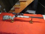 Thompson Center Encore 209X50 Camo with Nikon Scope - 1 of 20