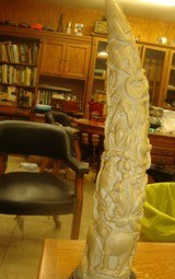 VINTAGE VERY OLD ELEPHANT TUSK ON A BASE 10 INCHES DIA. AT BASE 16 INCHES LONG COMPLETELY CARVED - 2 of 8