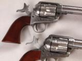 One Pair of "Taylors and Company" Stainless Steel .45LC 5 1/2" SAA Engraved Pistols! - 2 of 13