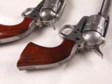 One Pair of "Taylors and Company" Stainless Steel .45LC 5 1/2" SAA Engraved Pistols! - 11 of 13