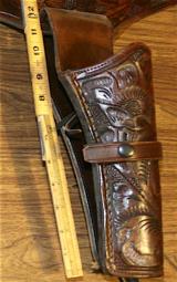 HOLSTER, SINGLE ACTION , LARGE FRAME,HAND TOOLED,SADDLE LEATHER, 45 INCHES TIP TO TIP
- 2 of 4