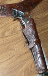 HOLSTER, SINGLE ACTION , LARGE FRAME,HAND TOOLED,SADDLE LEATHER, 45 INCHES TIP TO TIP
- 4 of 4