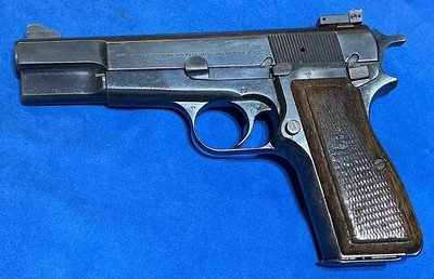 BROWNING HIGH POWER = 1986 MADE DATE INBELGIUM = SERVICE GRADE In Patina Finish = Numbers match , one Mag