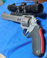 RAGING 22 HORNET = 10 INCH RIBBED BARREL = STAINLESS = PREMIRE SCOPE = CUSHIONED GRIPS = TAURUS HAND CANNON - 9 of 10